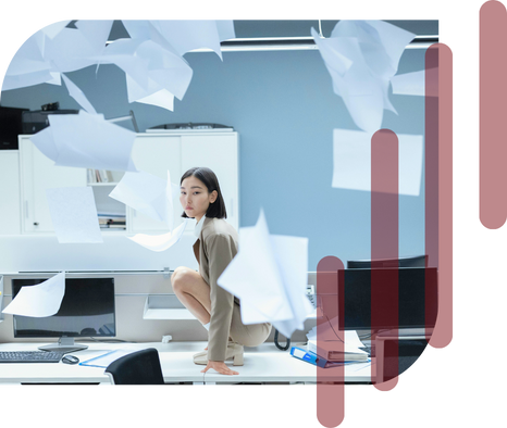 Secure your limited-time recruitment offer with Envol. Image includes a woman crouching on a desk in the workplace with papers flying all around her in disarray. Four semi-transparent vertical red lines overlay the image partially, symbolizing Envol's logo.