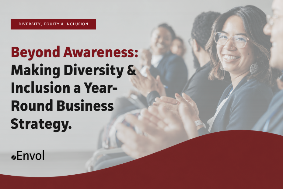 Banner image for an Envol blog titled "Beyond Awareness: Making Diversity & Inclusion a Year-Round Business Strategy," featuring a diverse group of professionals applauding at a workplace event, with one smiling woman in the foreground.